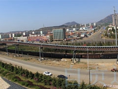 日照岚山港铁矿石输送大型管带机系统工程重载运行成功